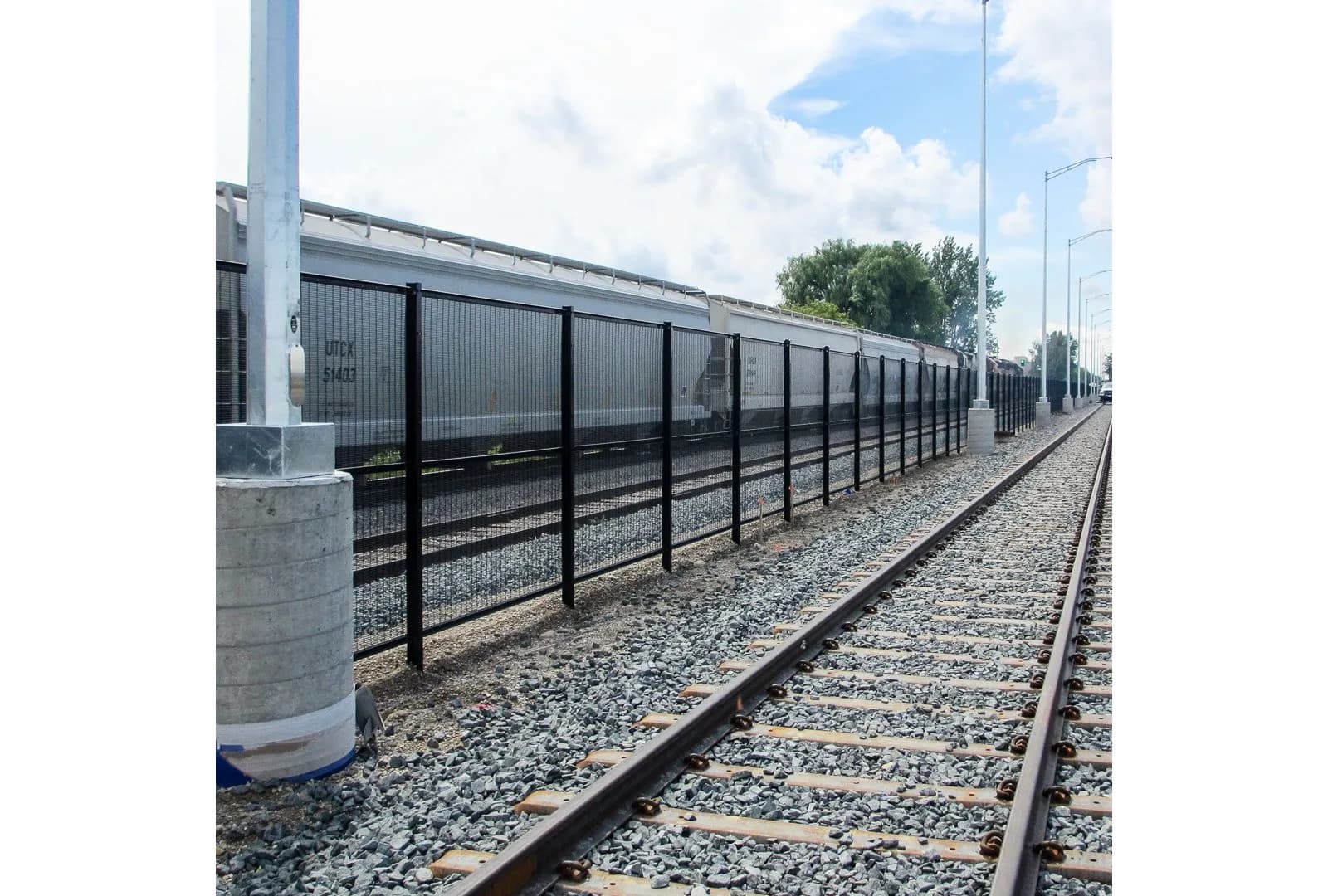 Anti-climb welded mesh fencing securing a rail corridor perimeter